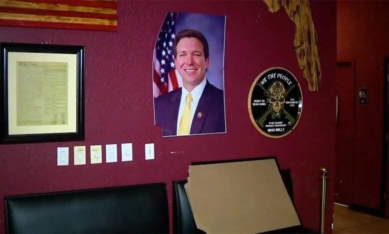 DeSantis photo displayed in bar damaged after suspect took it into restroom