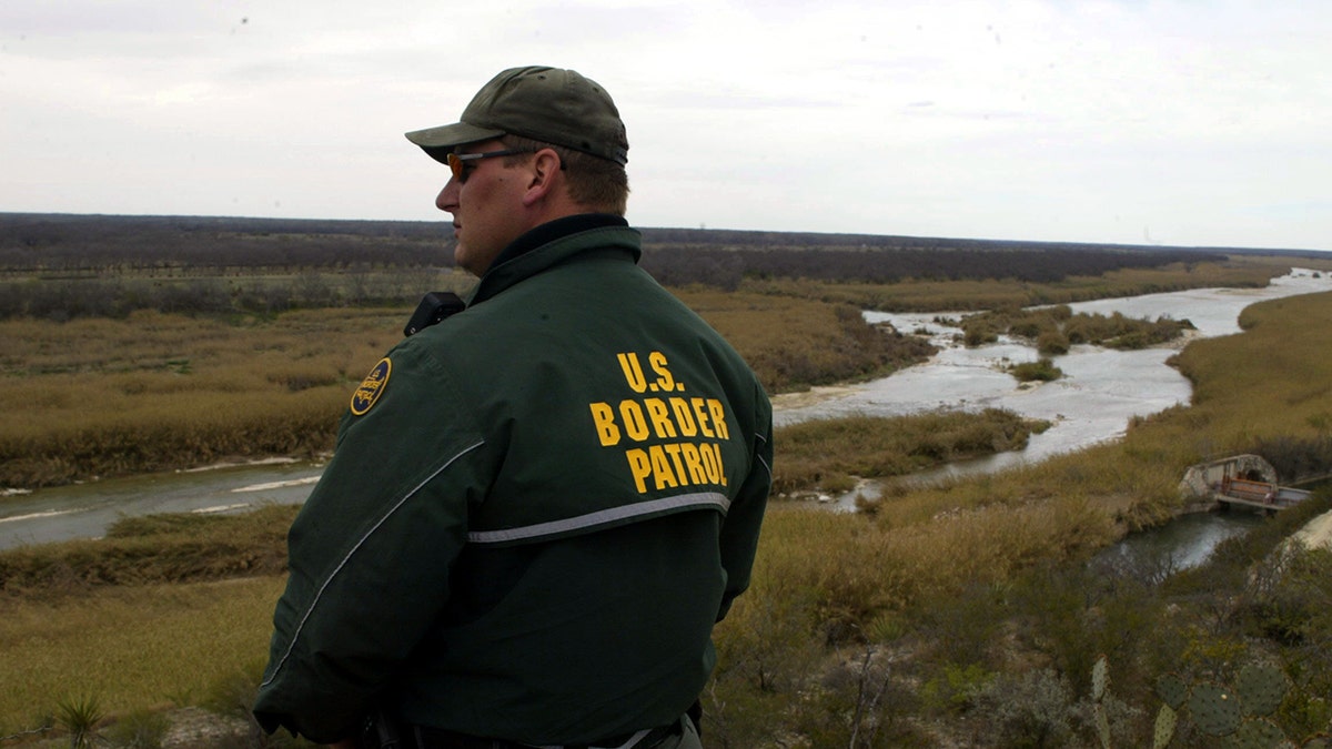 A USBP official by a river