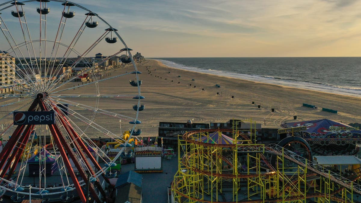 Ocean City boardwalk with ferris wheel at sunset