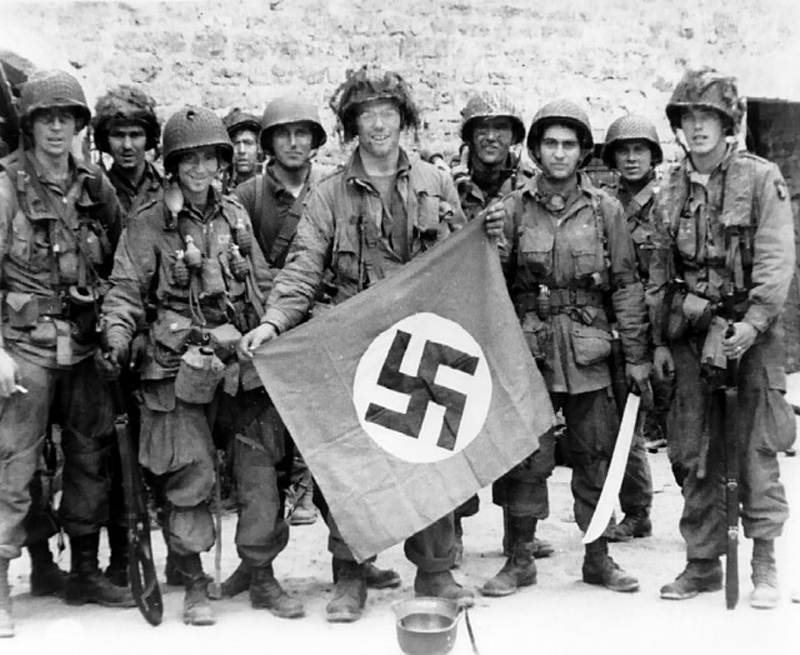 101st Airborne troopers with Nazi flag in Normandy