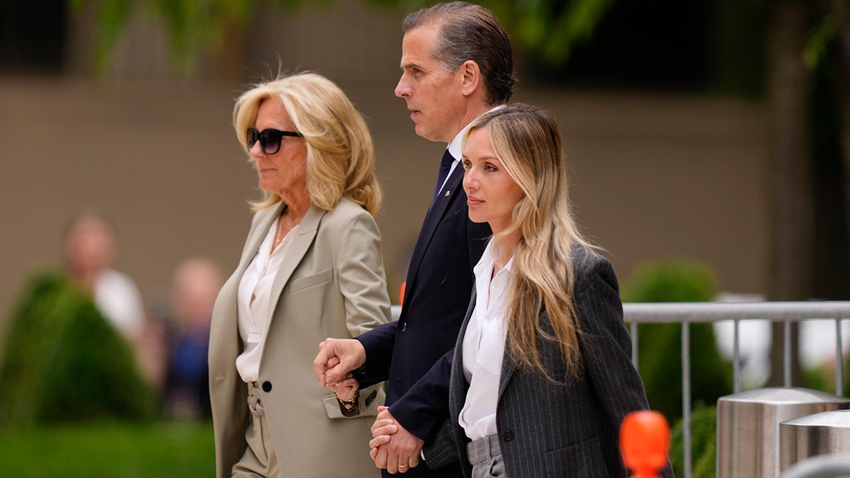 Hunter Biden flanked by Jill Biden and Melissa Cohen Biden departing federal court.
