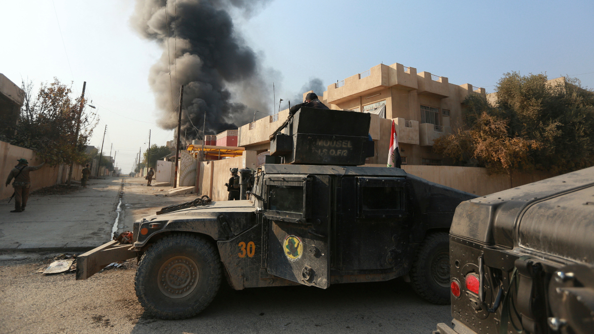 Smoke rises as Iraq's elite counterterrorism forces fight against Islamic State militants