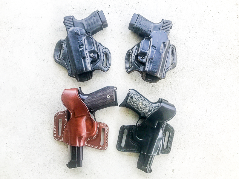 Two Glock30 and two Berettas in matching mirror-image holsters