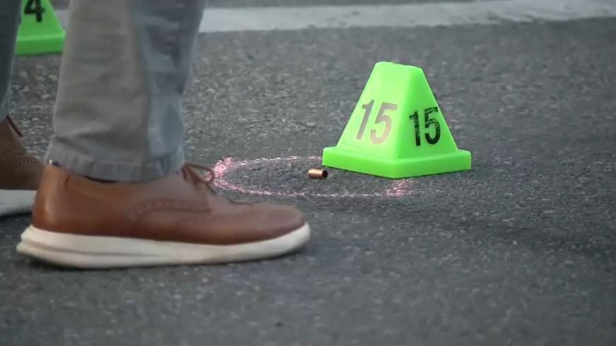 bullet casing and evidence marker in street