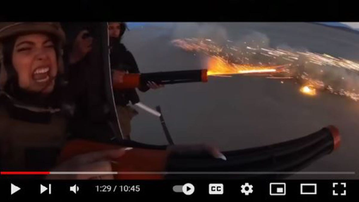 Women shooting fireworks out of a helicopter