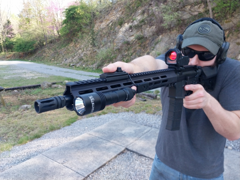 Man shooting an AR-15 rifle