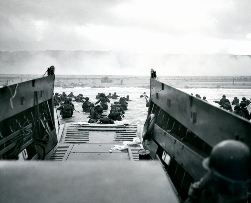 Soldiers debark from a Higgins LCVP on Omaha Beach