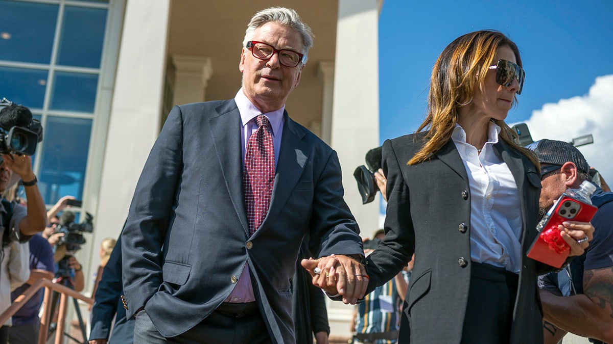 Alec Baldwin and his wife Hilaria Baldwin leave District Court