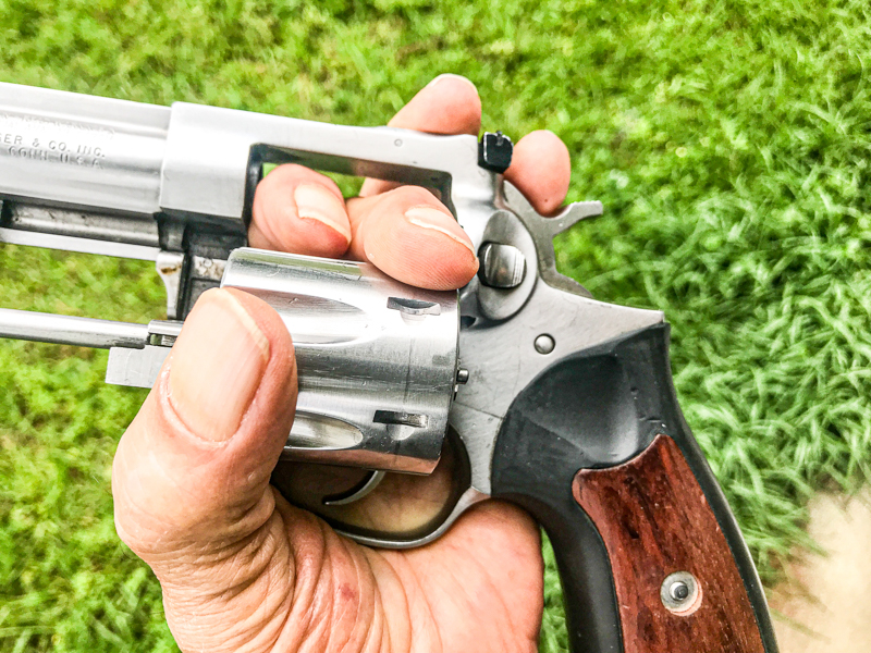 Revolver with fingers on open cylinder