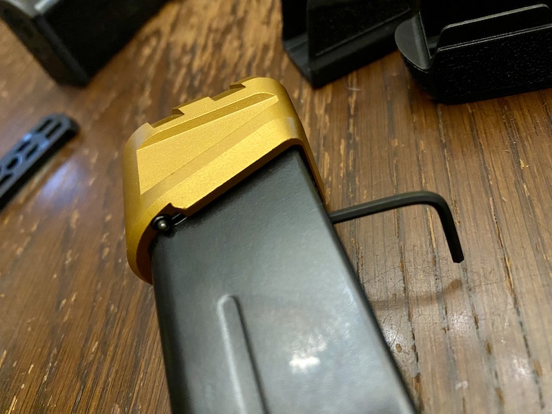 To install the Tyrant extension, I braced the spring with an Allen wrench. Press it in with your finger, then pin it through a witness hole on the mag body and install. Note the tiny glimmer on the edge of the extension--this is the pin that locks it in place.