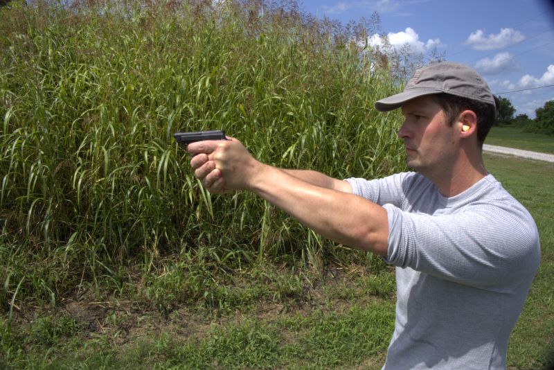 earplugs in place while shooting a beretta bobcat