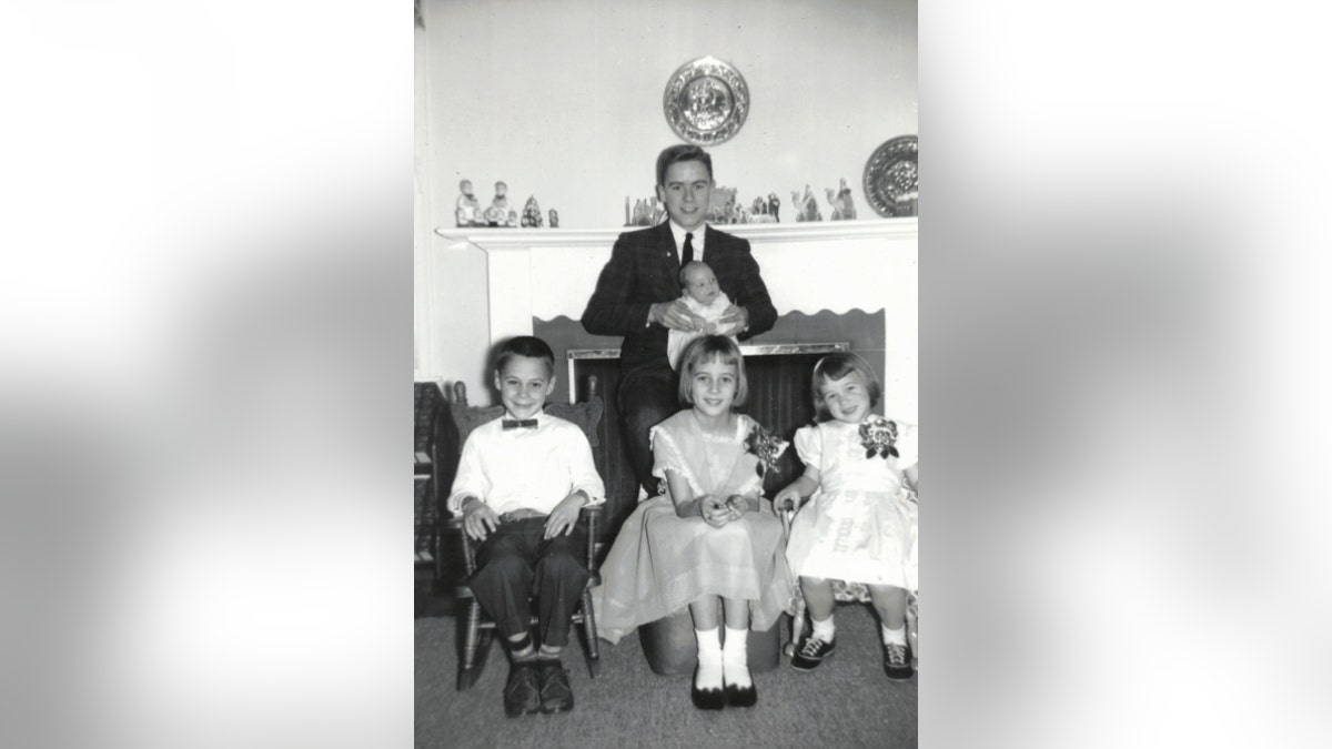 Ted Bundy (center) pictured with his younger half-siblings.