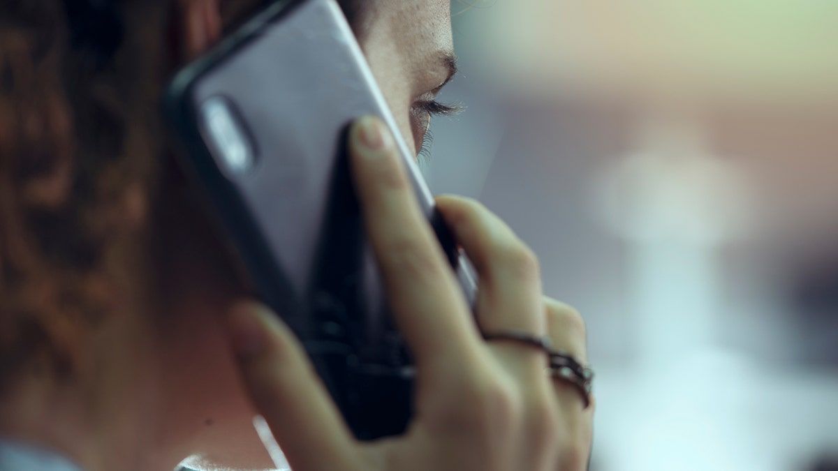 A woman making a call on her cell phone