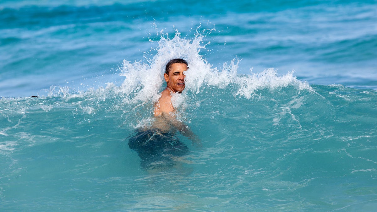 U.S. President Barack Obama jumps into the ocean at Pyramid Rock Beach