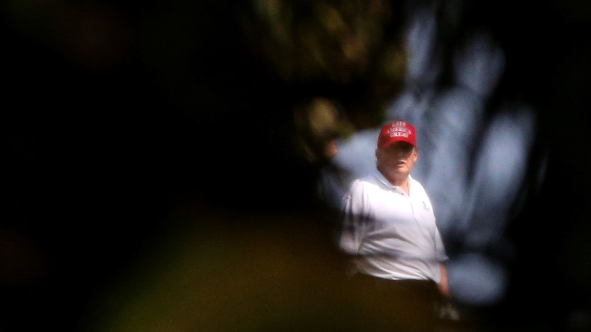 Donald Trump plays golf at the Trump International Golf Club in West Palm Beach