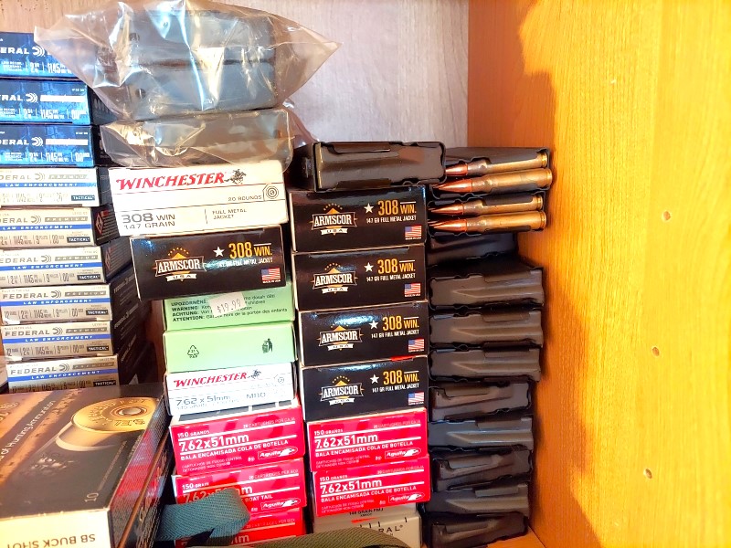 Ammo and magazines on a shelf.