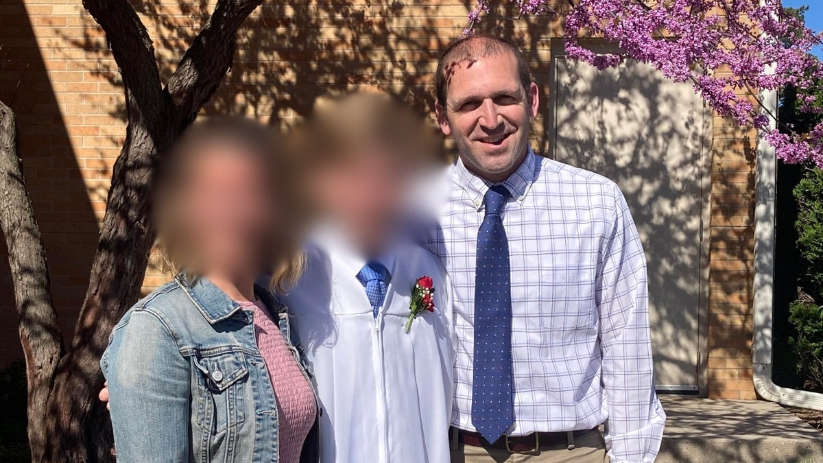 Borgwardt poses with his wife and son