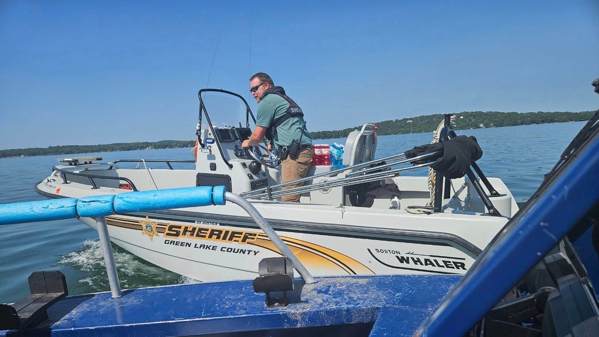 A Green Lake County Sheriff's boat searches for Borgwardt