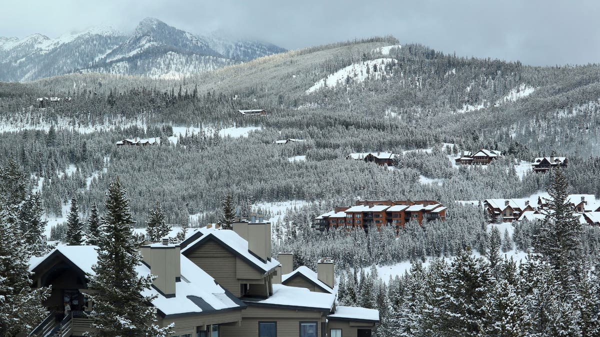 Big Sky Ski Resort in the winter featuring condos and housing in the mountains