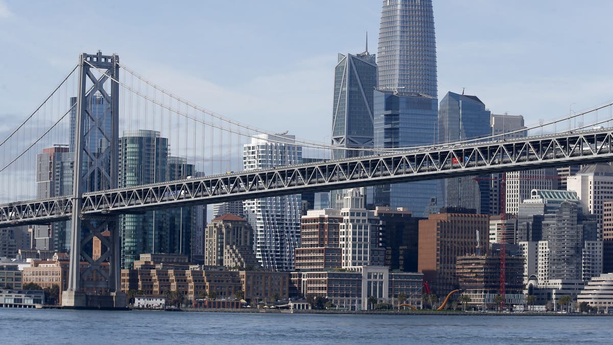 The Bay Bridge and the San Francisco skyline are seen in this view from the bay on March 9, 2020. 