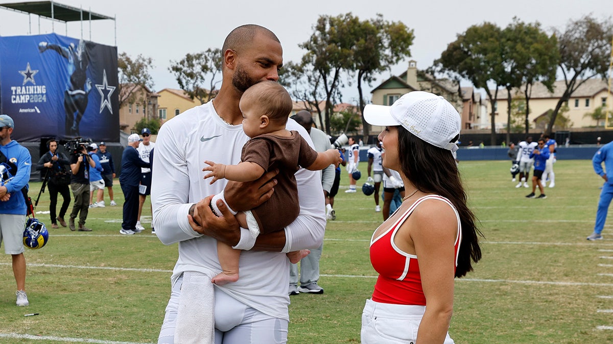 Dak Prescott holds daughter alongside Sarah Ramos