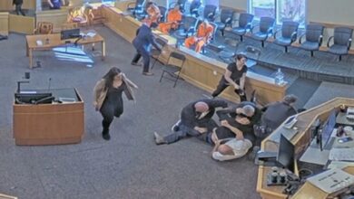 Video captures courtroom brawl as two men attack murder suspect during hearing