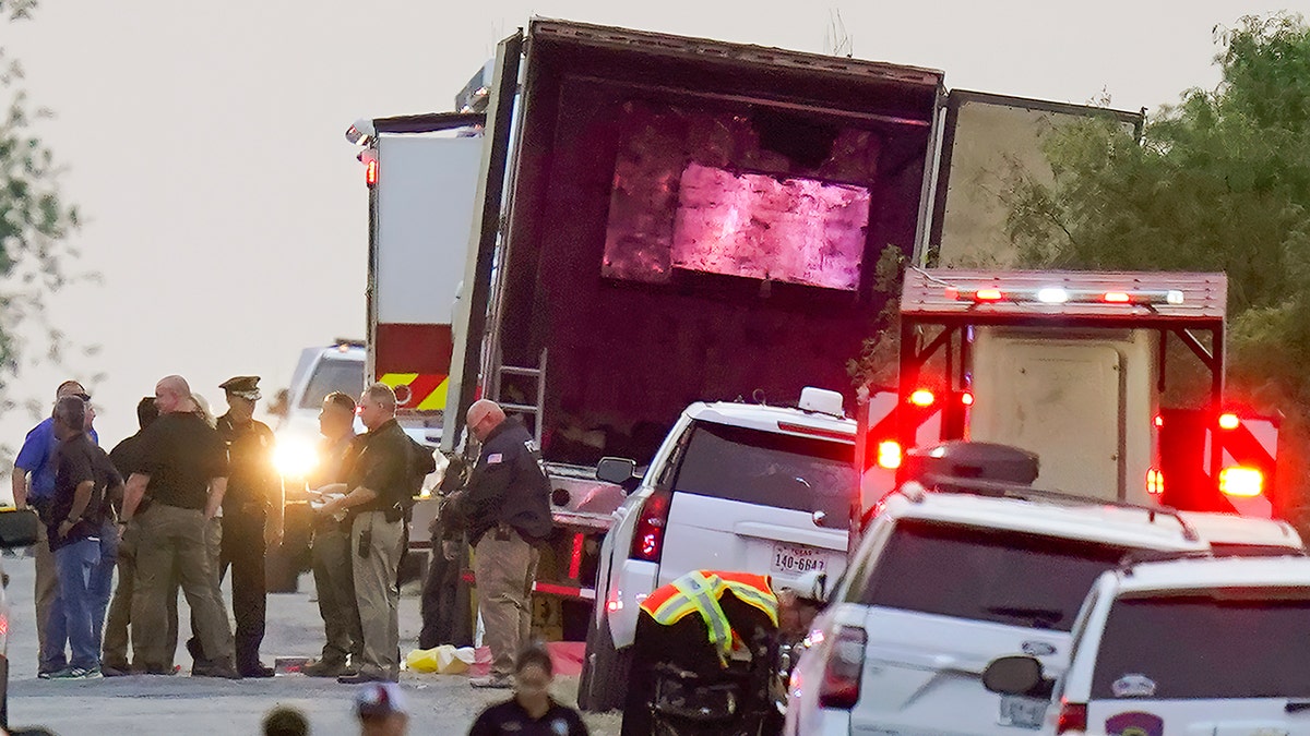 Police and other first responders work the scene where officials say dozens of people have been found dead and multiple others were taken to hospitals with heat-related illnesses after a semitrailer containing suspected migrants was found on Monday, June 27, 2022 in San Antonio.