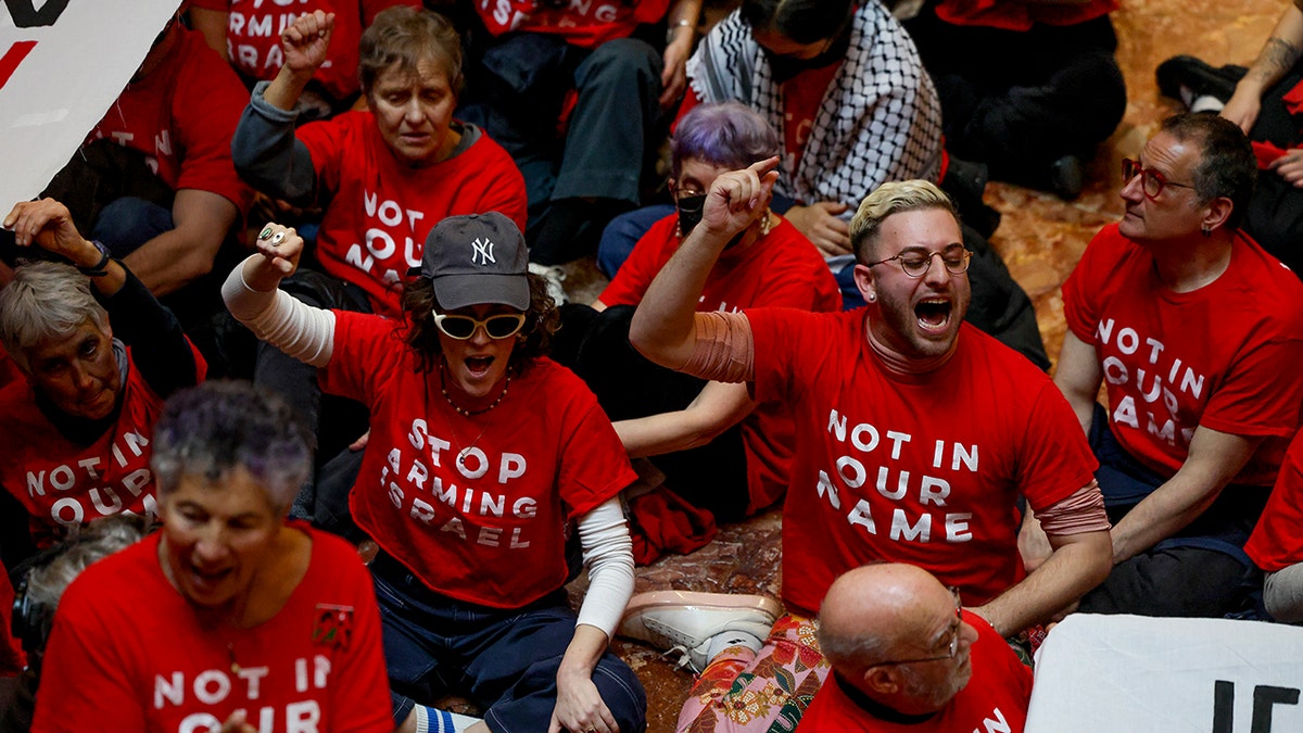 Demonstrators from the group Jewish Voice for Peace are seen inside Trump Tower on Thursday, March 13.