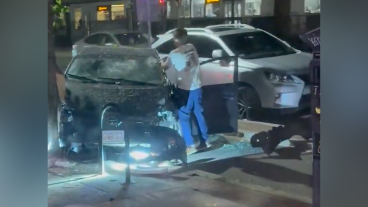 Man hitting a car