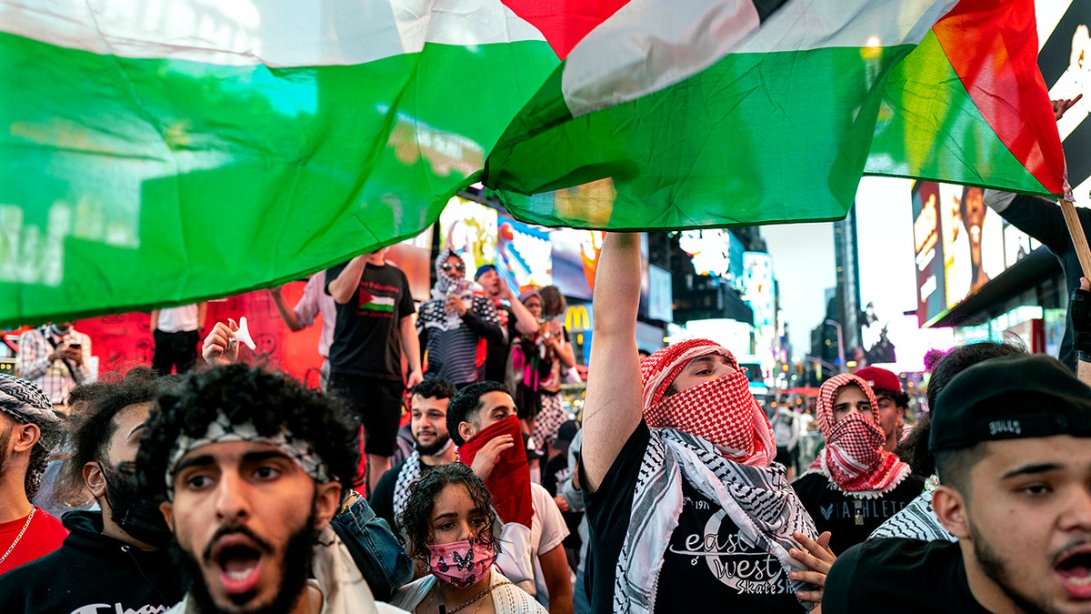 Supporters of the Palestinians march in New York Thursday, May 20, 2021. Israel and Hamas announced a cease-fire, ending a bruising 11-day war that caused widespread destruction in the Gaza Strip and brought life in much of Israel to a standstill. (AP Photo/Craig Ruttle)
