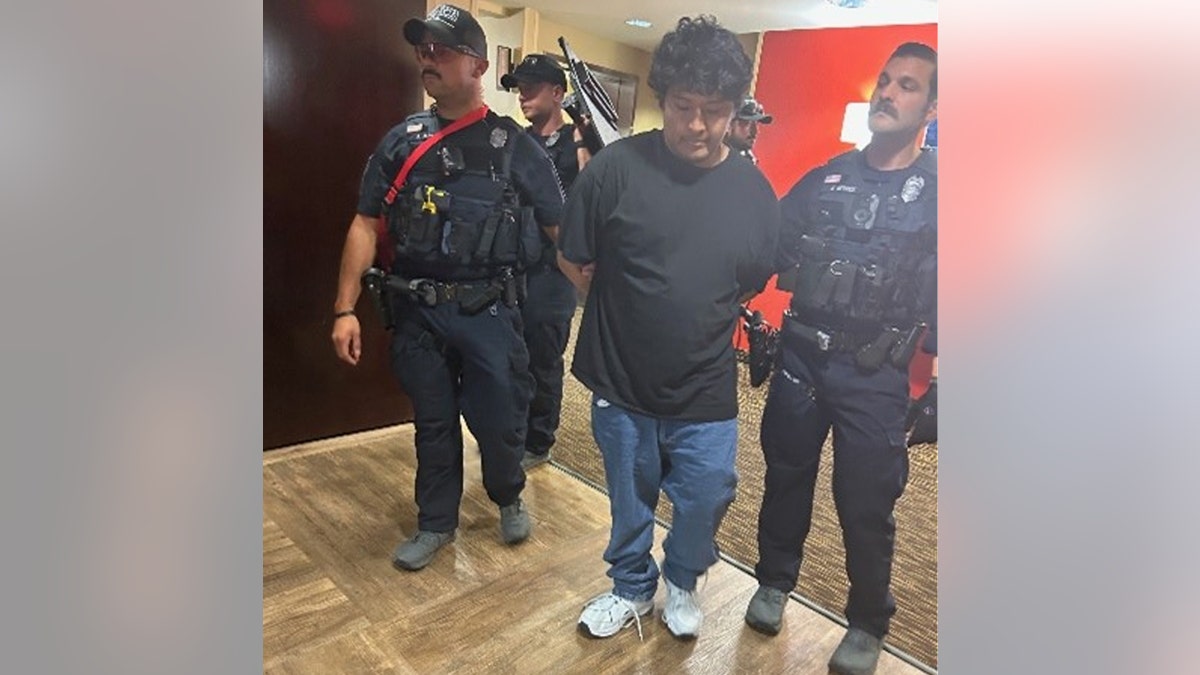 26-year-old Andres Caceres Jaldin being arrested by police