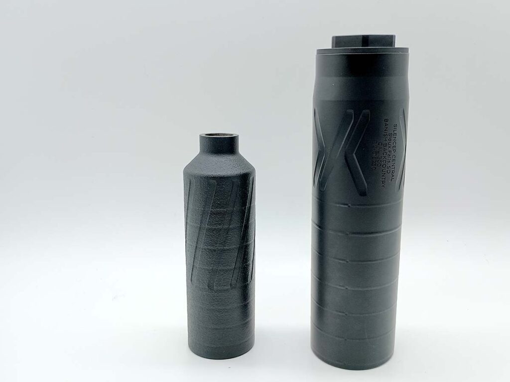 The Banish Backcountry (right) next to a Banish 9K pistols suppressor. It's bigger, but not considerably so. And it's titanium construction keeps it feather light. 