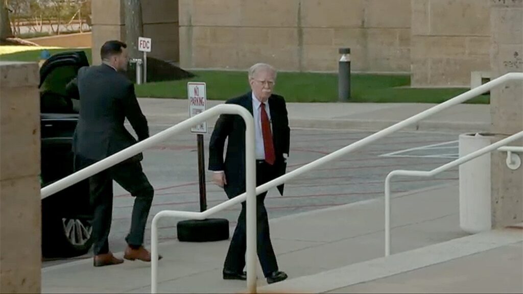 John Bolton surrenders to face charges of sharing classified information