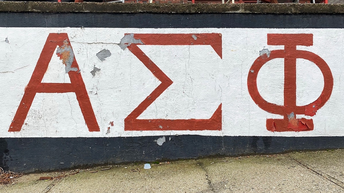 Alpha Sigma Phi’s greek letters written on a wall