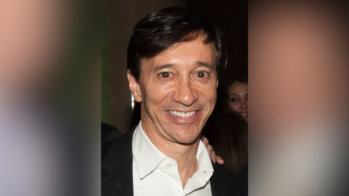 Financier Howard Rubin smiling at an event.