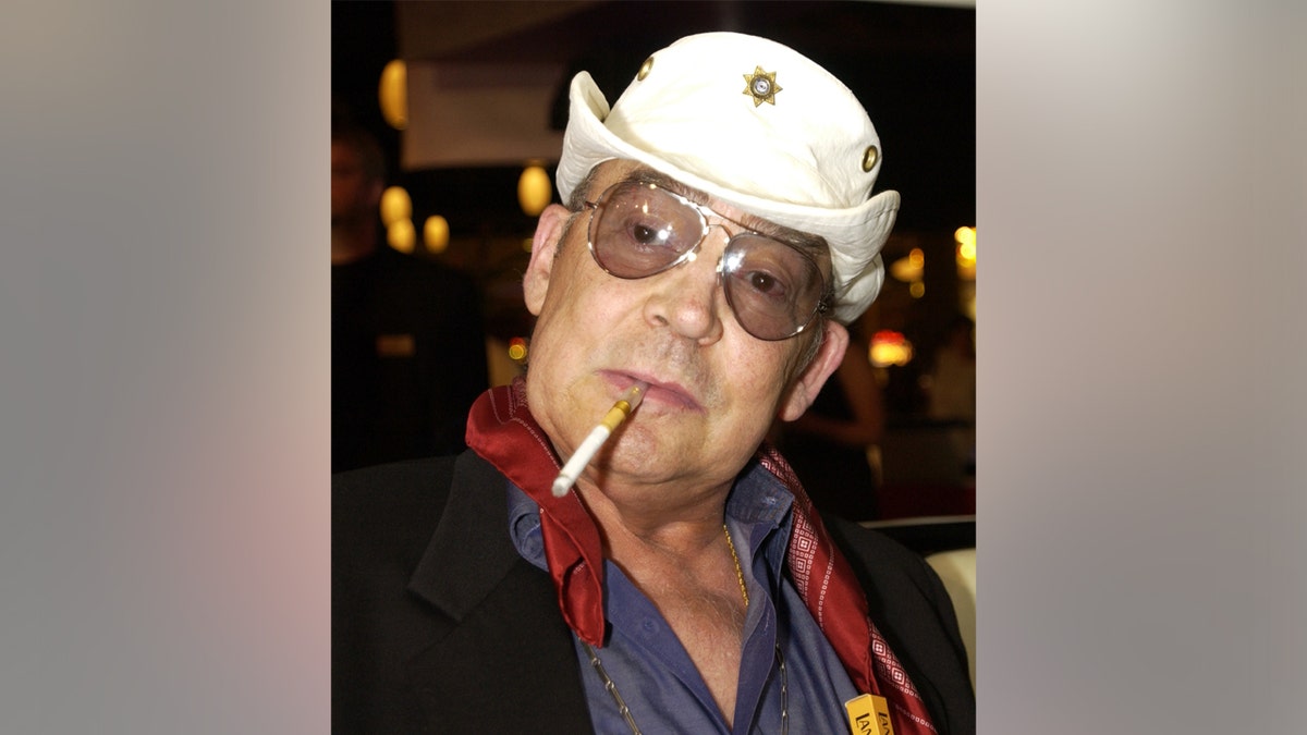A photo of Hunter S. Thompson with a cigarette in his mouth