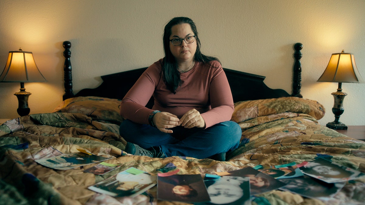 Kerri Rawson surrounded by photos of her childhood.