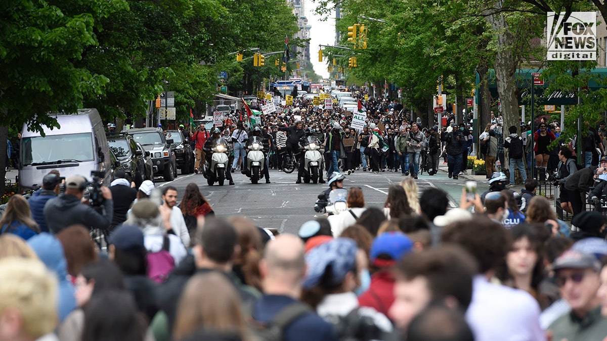 Anti-Israel protesters make their way down Fifth Avenue toward Washington Square Park