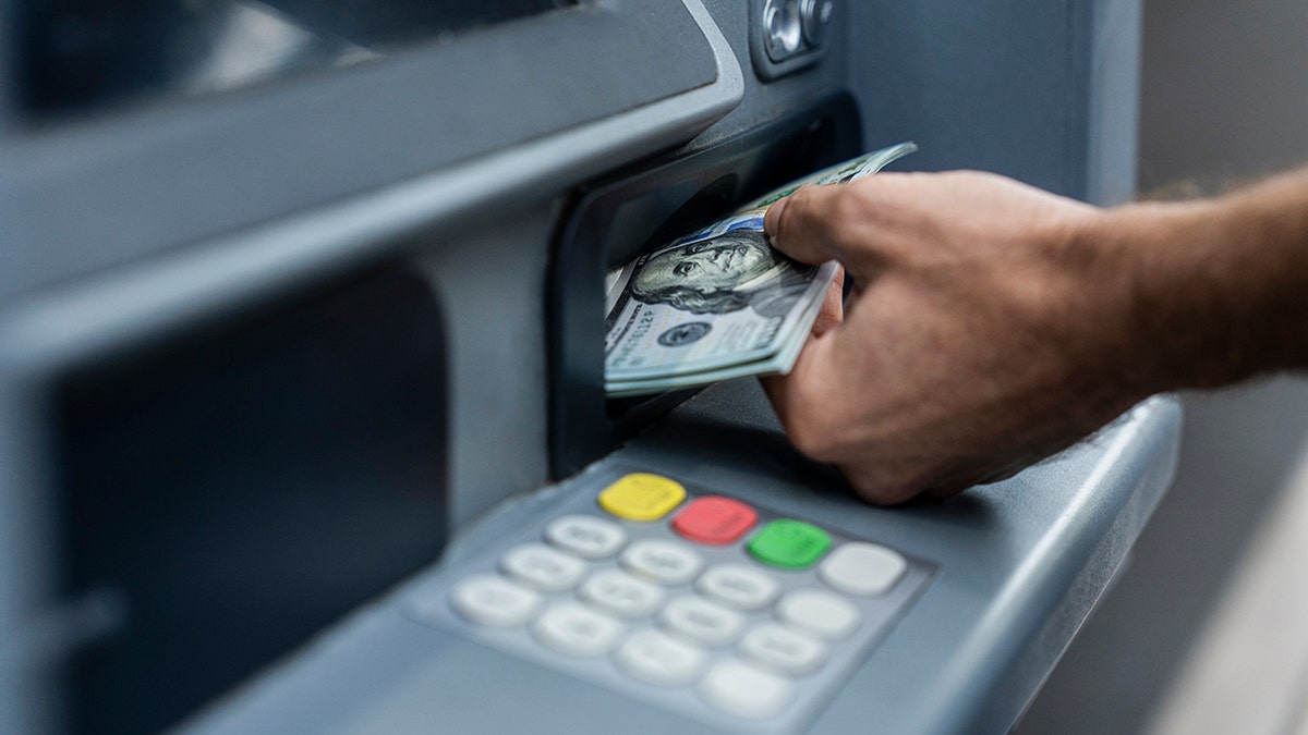 An ATM machine dispensing money