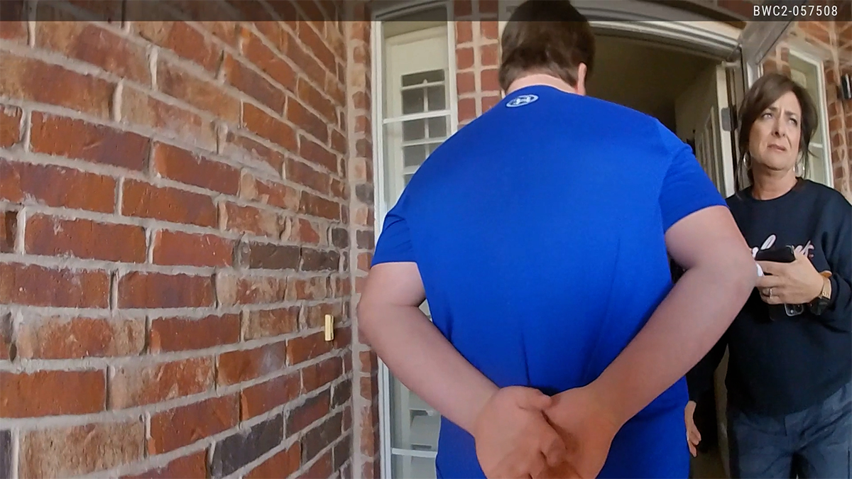 Jesse Butler being handcuffed