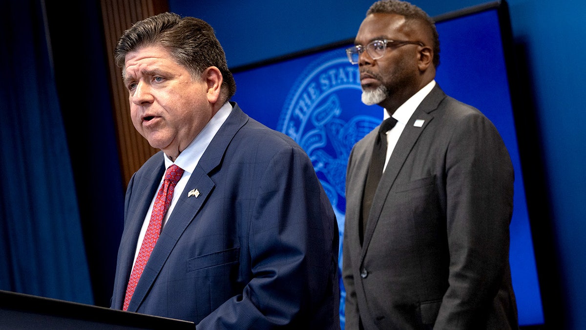 Illinois Governor JB Pritzker speaks at a press conference as Chicago Mayor Brandon Johnson listens, addressing President Trump’s threat to deploy the National Guard and increase ICE enforcement in Chicago.