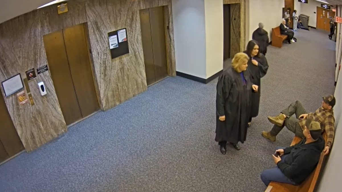 Milwaukee County Judge Hannah Dugan speaking with ICE agents