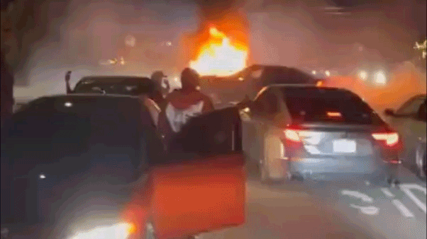 Arrest made after explosive street takeover video shows mob ambushing couple during fiery car meetup Arrest made after explosive street takeover video shows mob ambushing couple during fiery car meetup