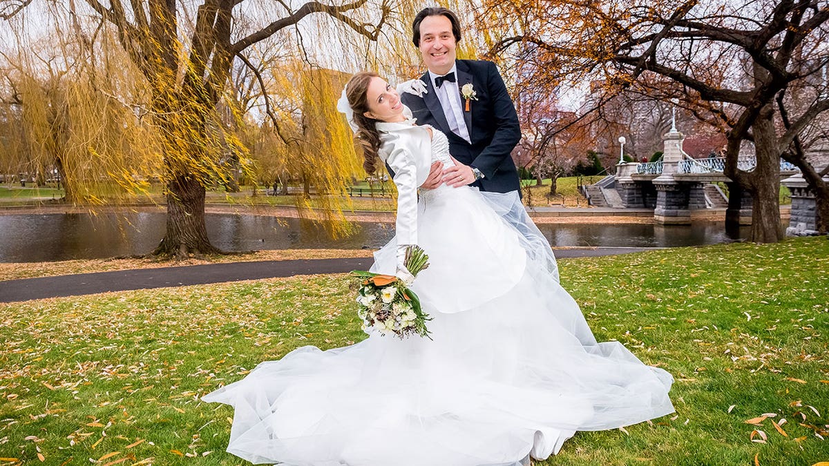 Ana and Brian Walshe pose outside on their wedding day