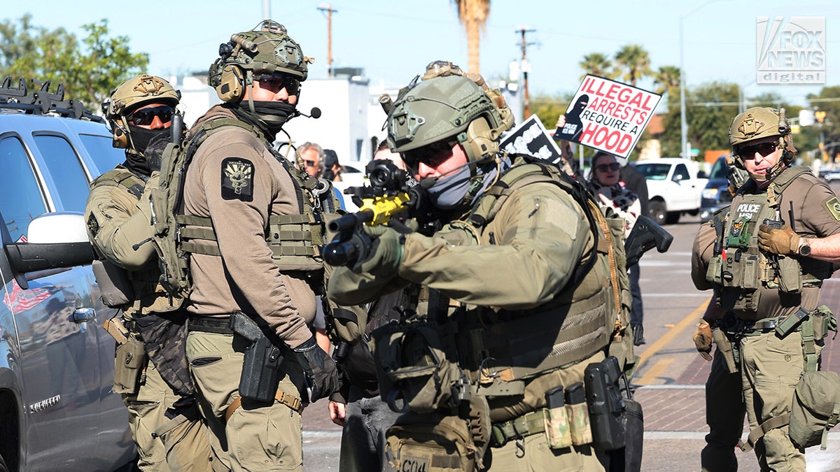 an agent readies a weapon