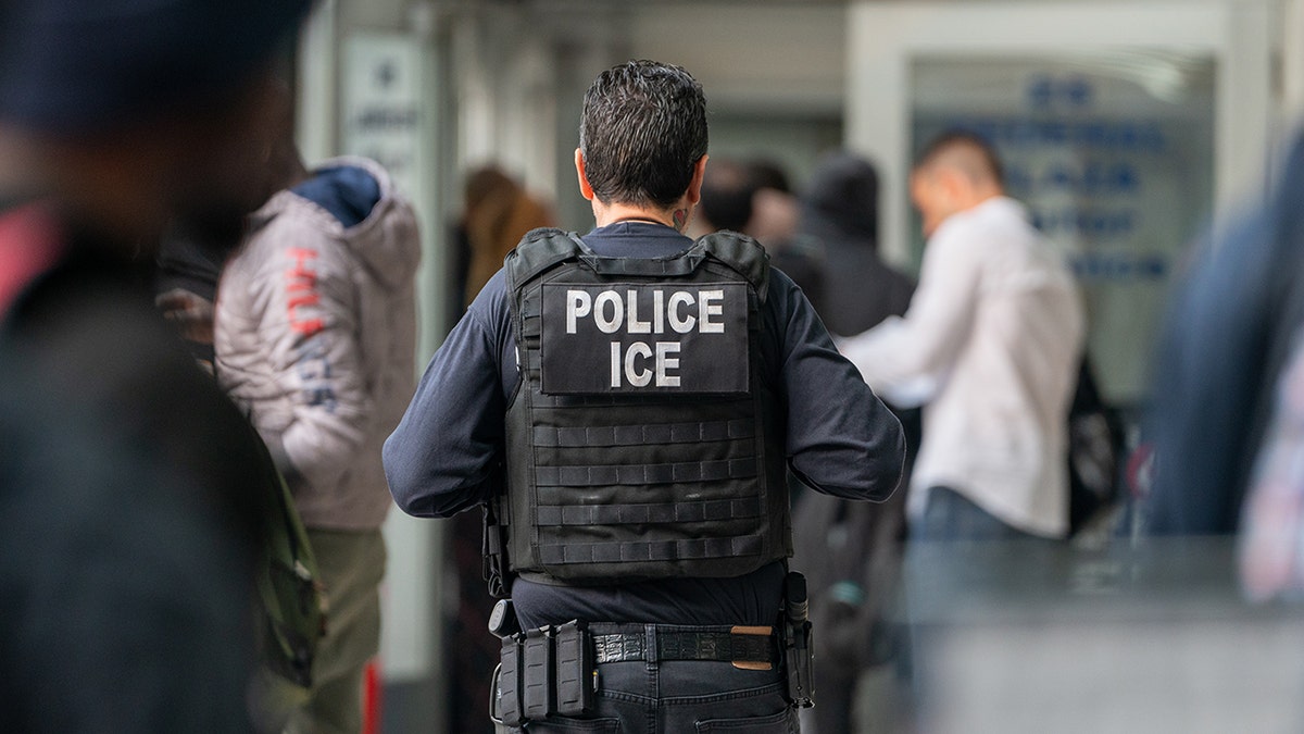 An ICE agent monitors hundreds of asylum seekers