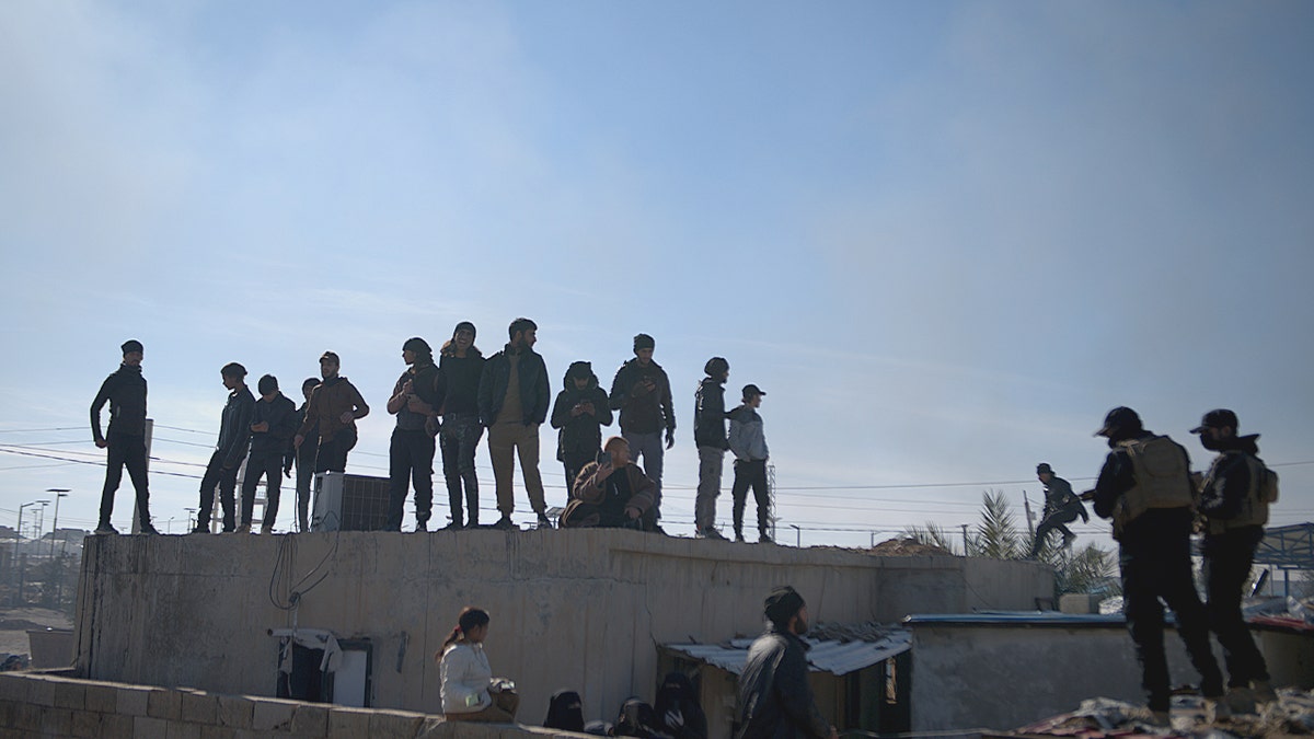Syrian detention camp and government forces.
